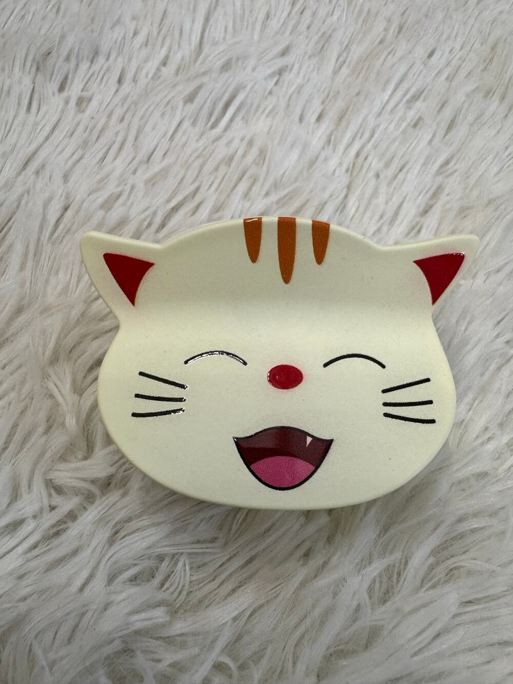 Large yellow cat hair clip claw with orange stripes on ears and forehead